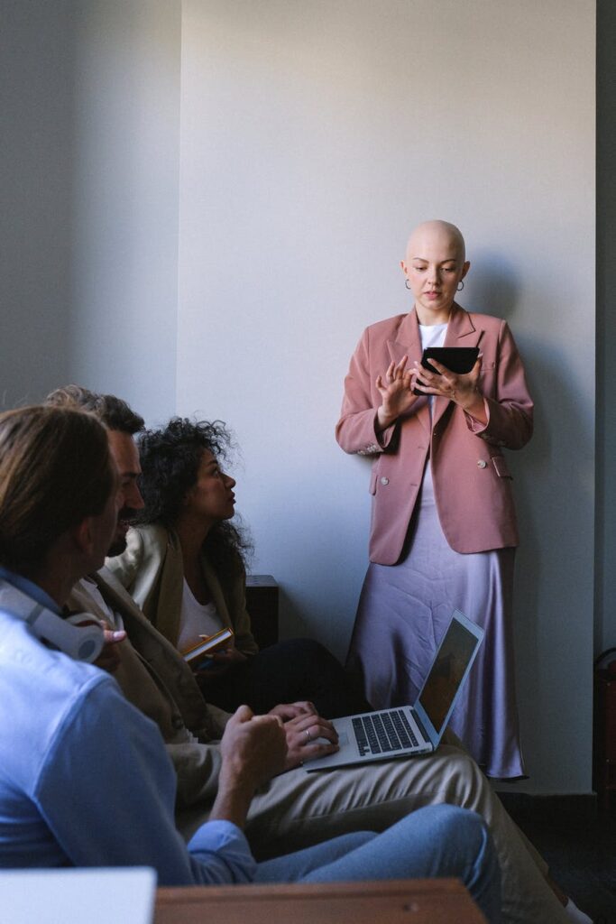 coworkers having conversation in meeting room