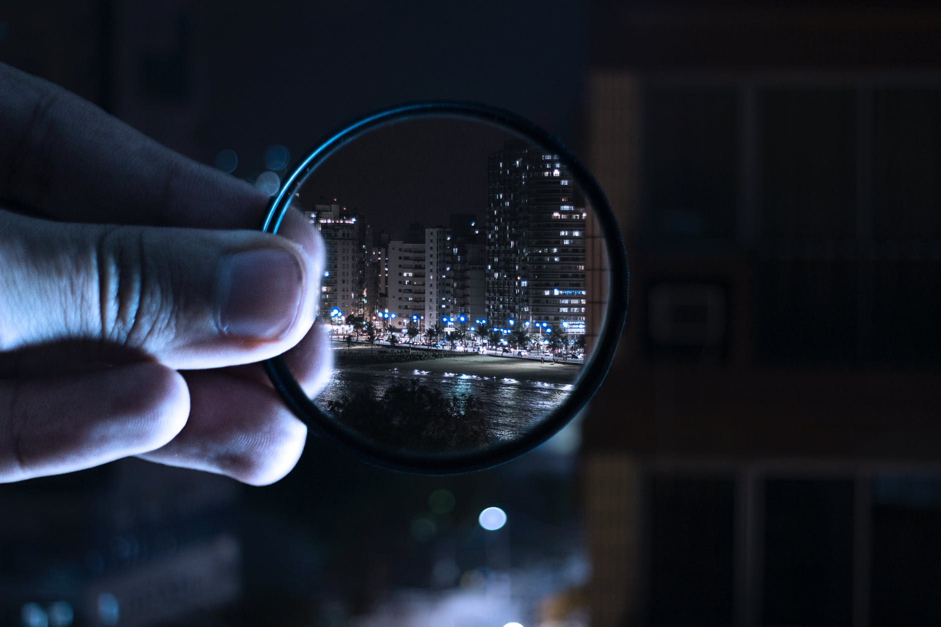 person holding magnifying glass