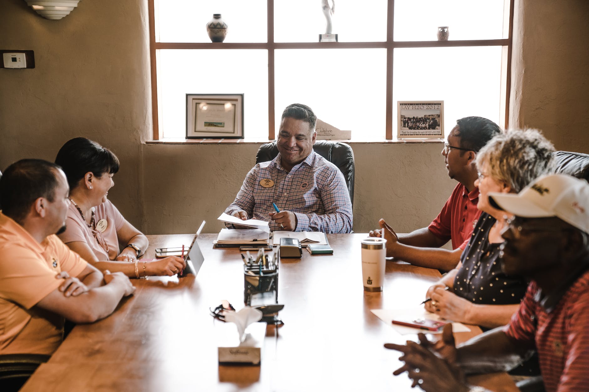 people sitting around wooden table