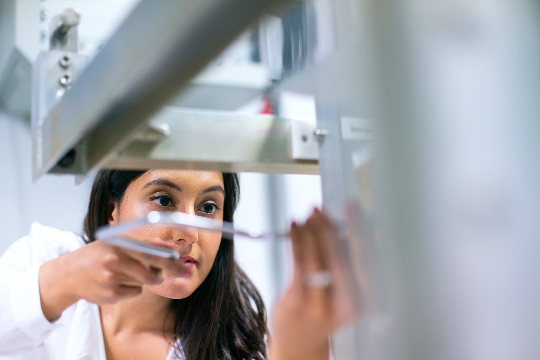 photo of female engineer working on an equipment