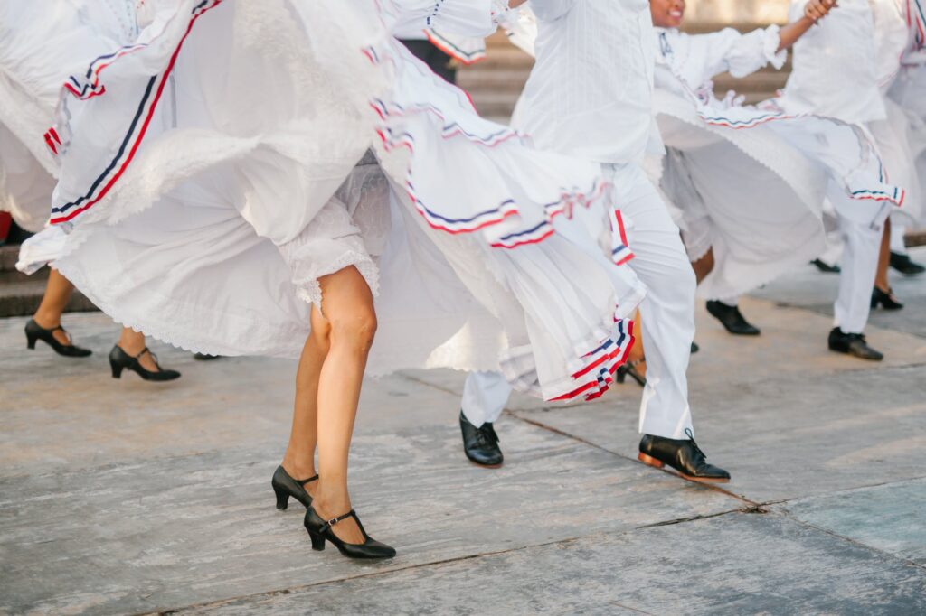 anonymous dancers performing show on street