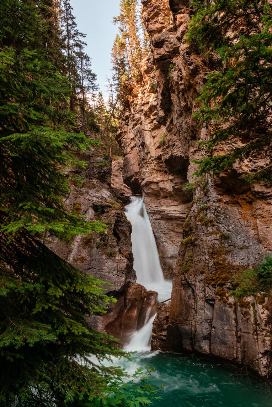 fast waterfall streaming from rough stiff mountain