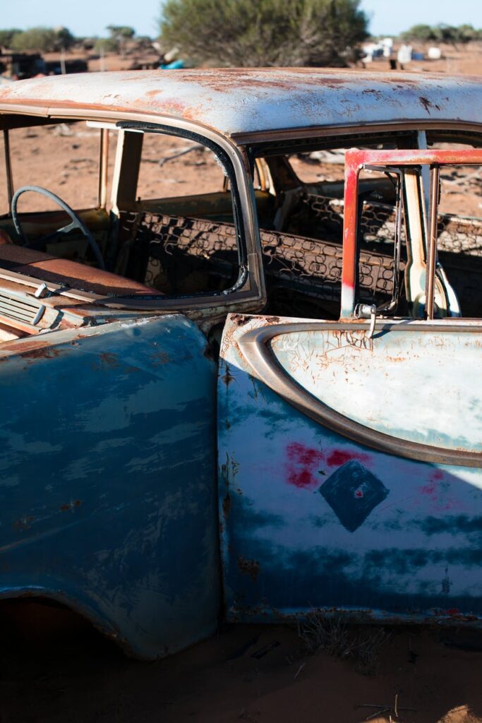 broken car in sunny countryside