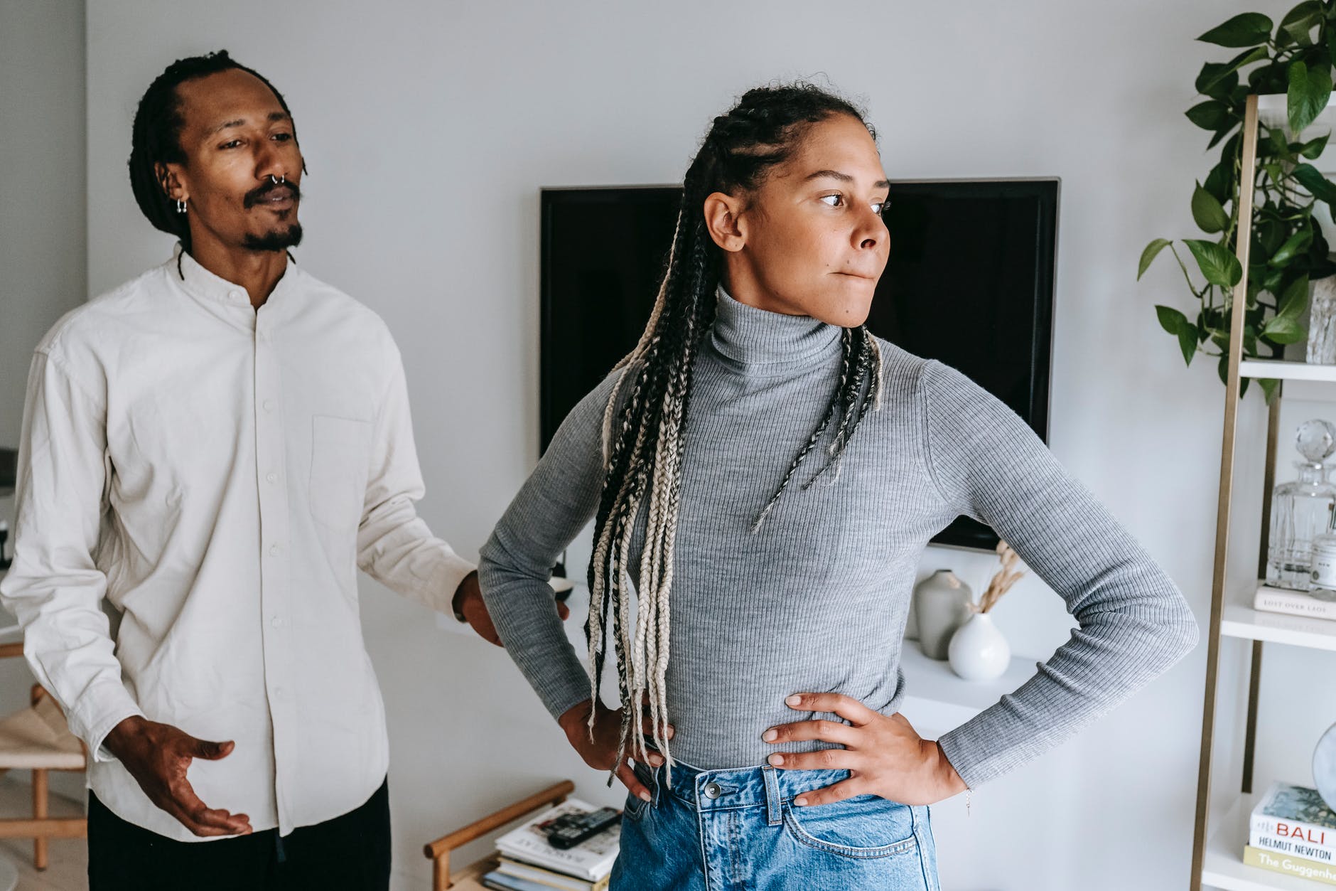 black man apologizing while talking with girlfriend