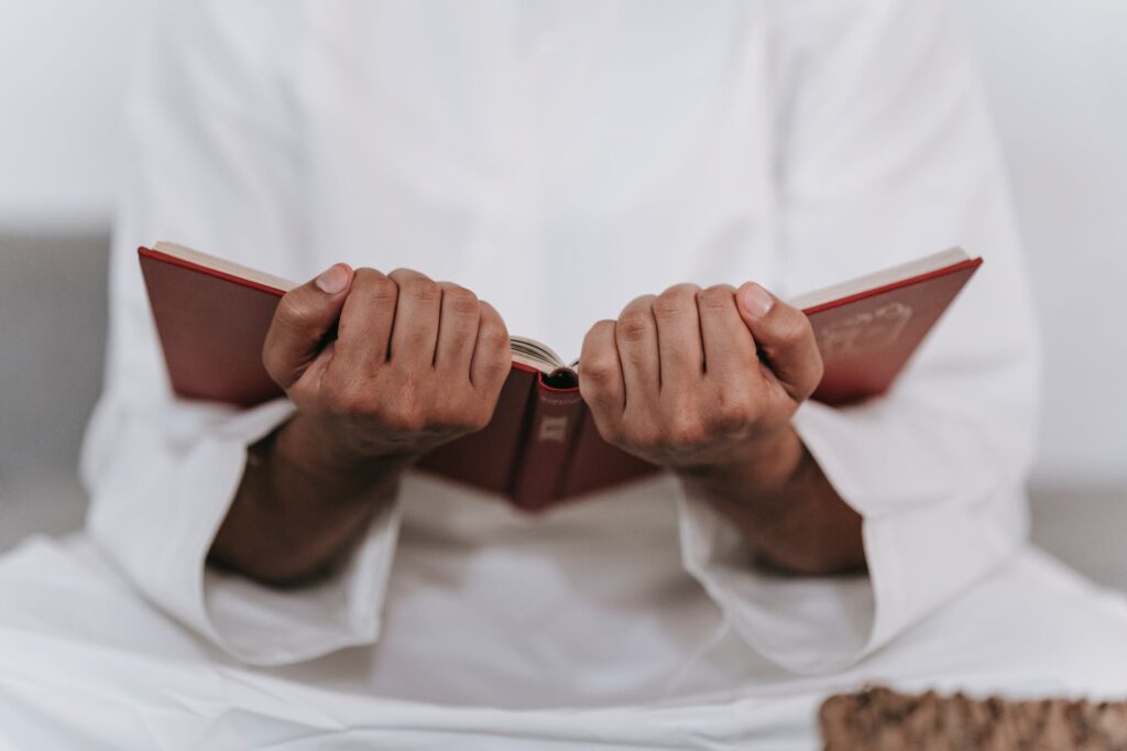 person holding a quran