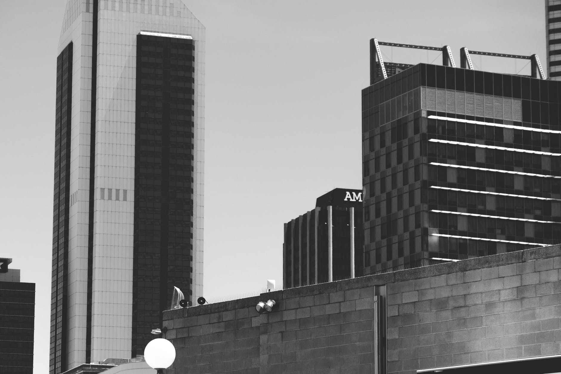 contemporary multistory commercial buildings under cloudy sky