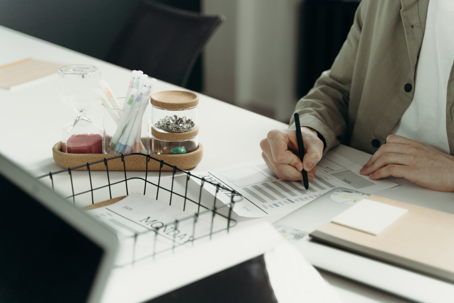 person writing on white paper