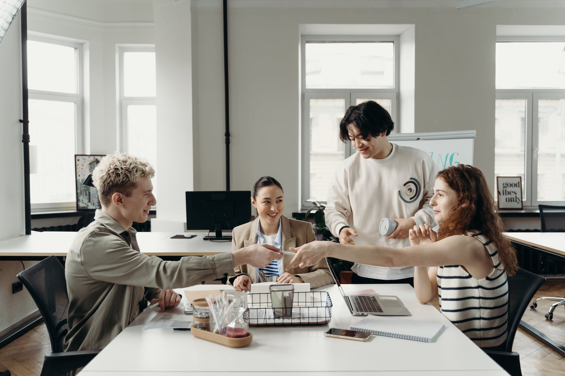 group of people sitting in front of a table