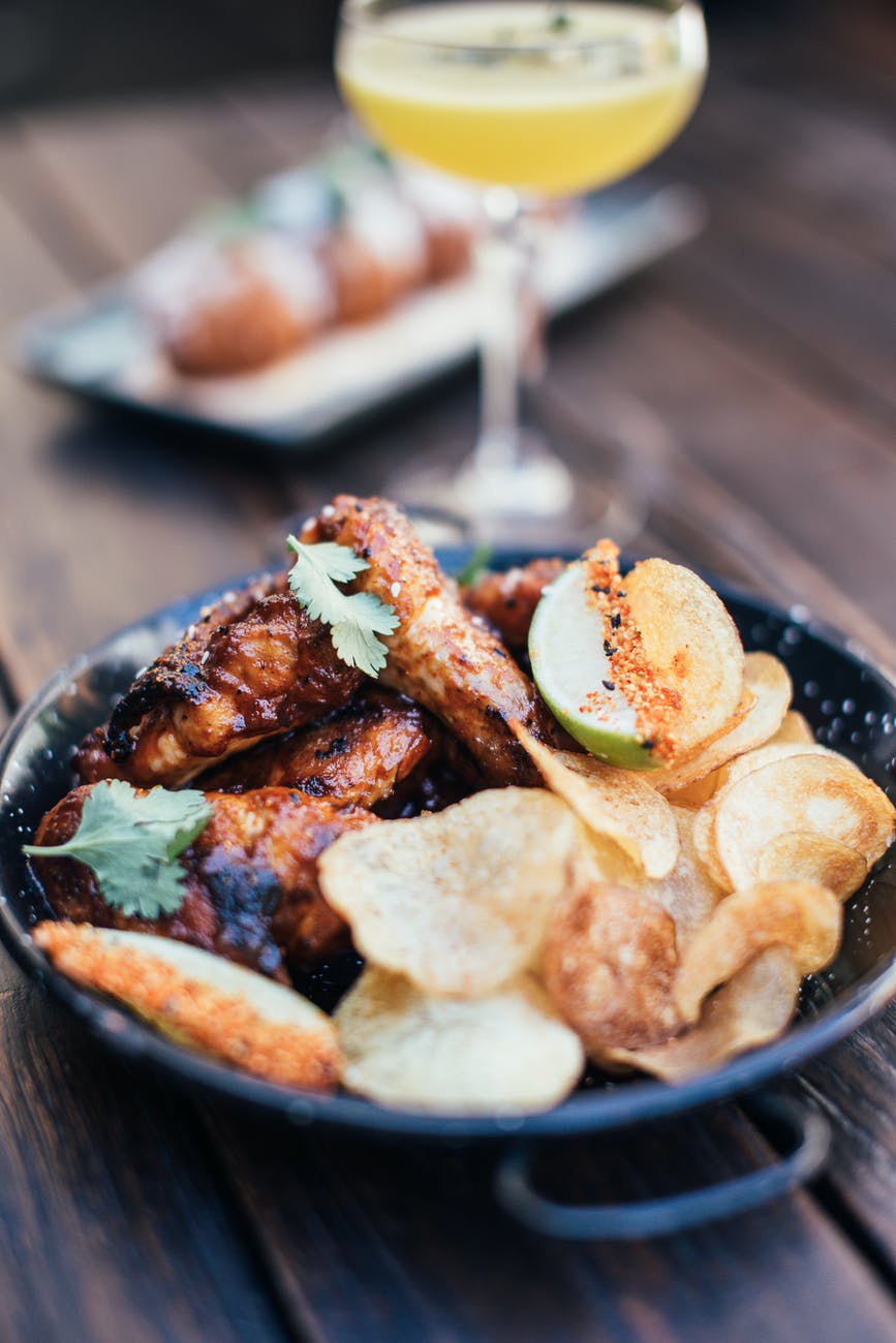 grilled chicken with chips in bar