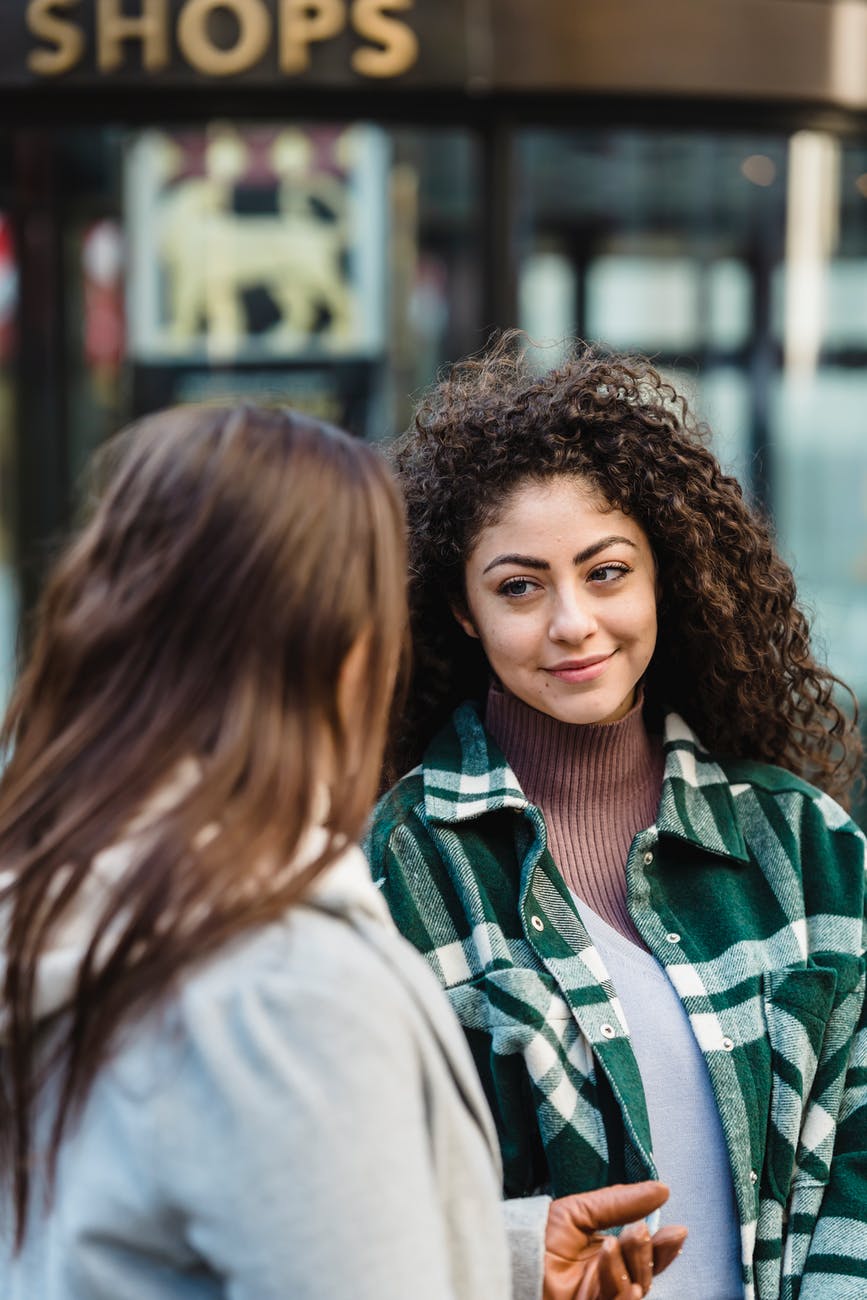 young women on stroll together having conversation