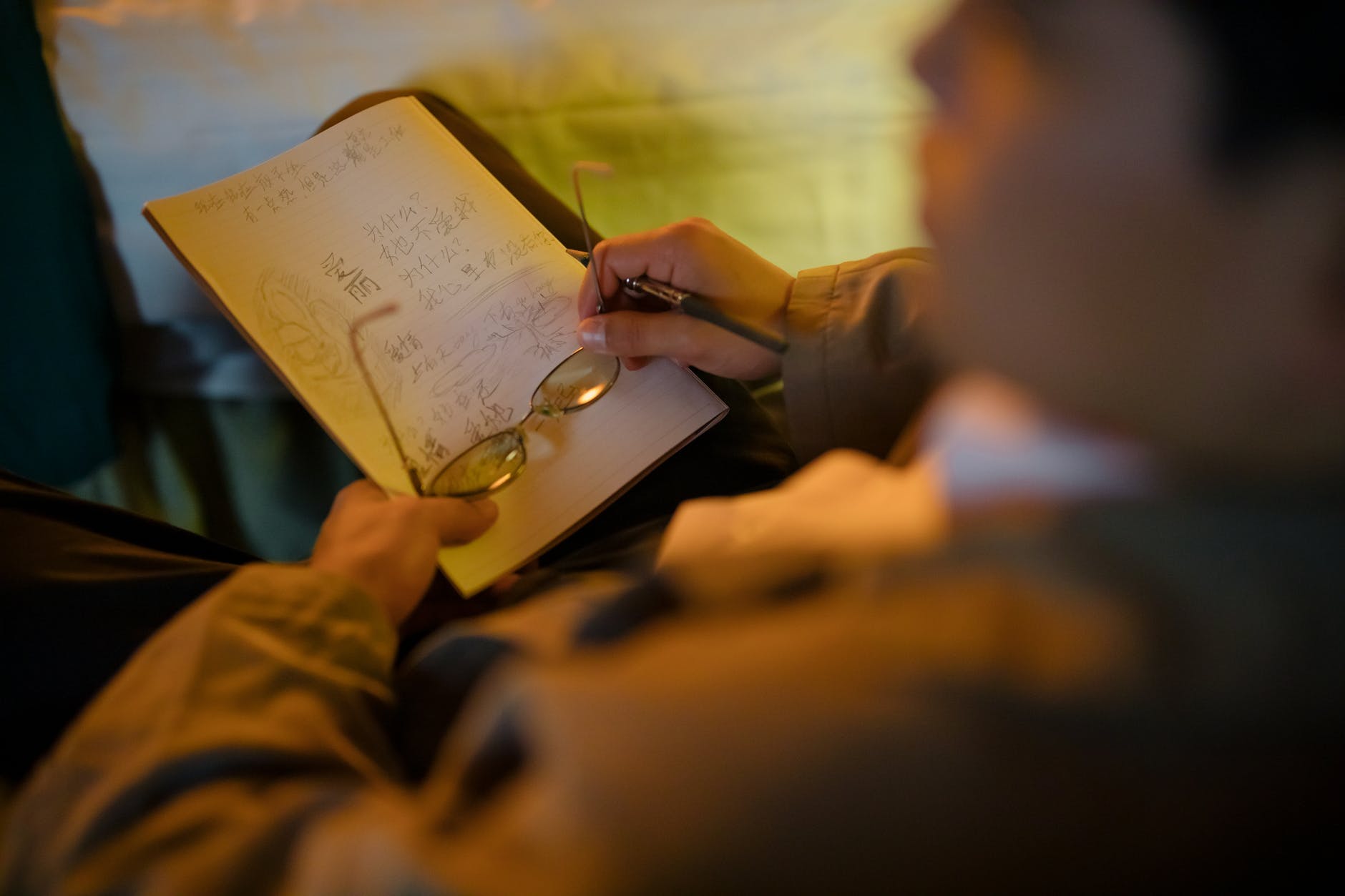 man holding a notebook