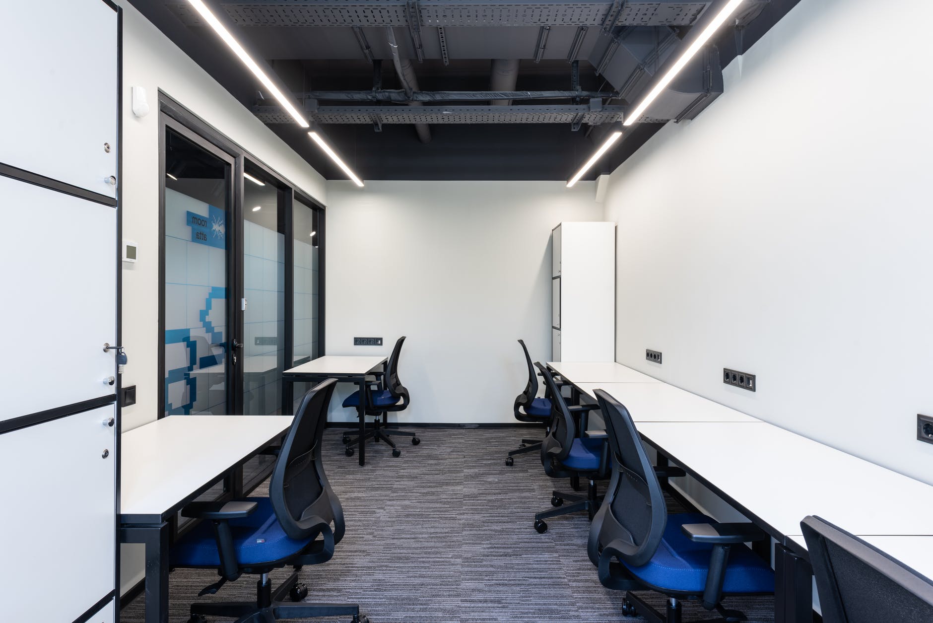 modern workplace with chairs near tables