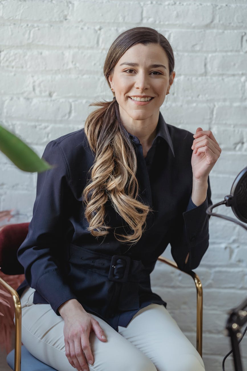 cheerful woman with long wavy hair