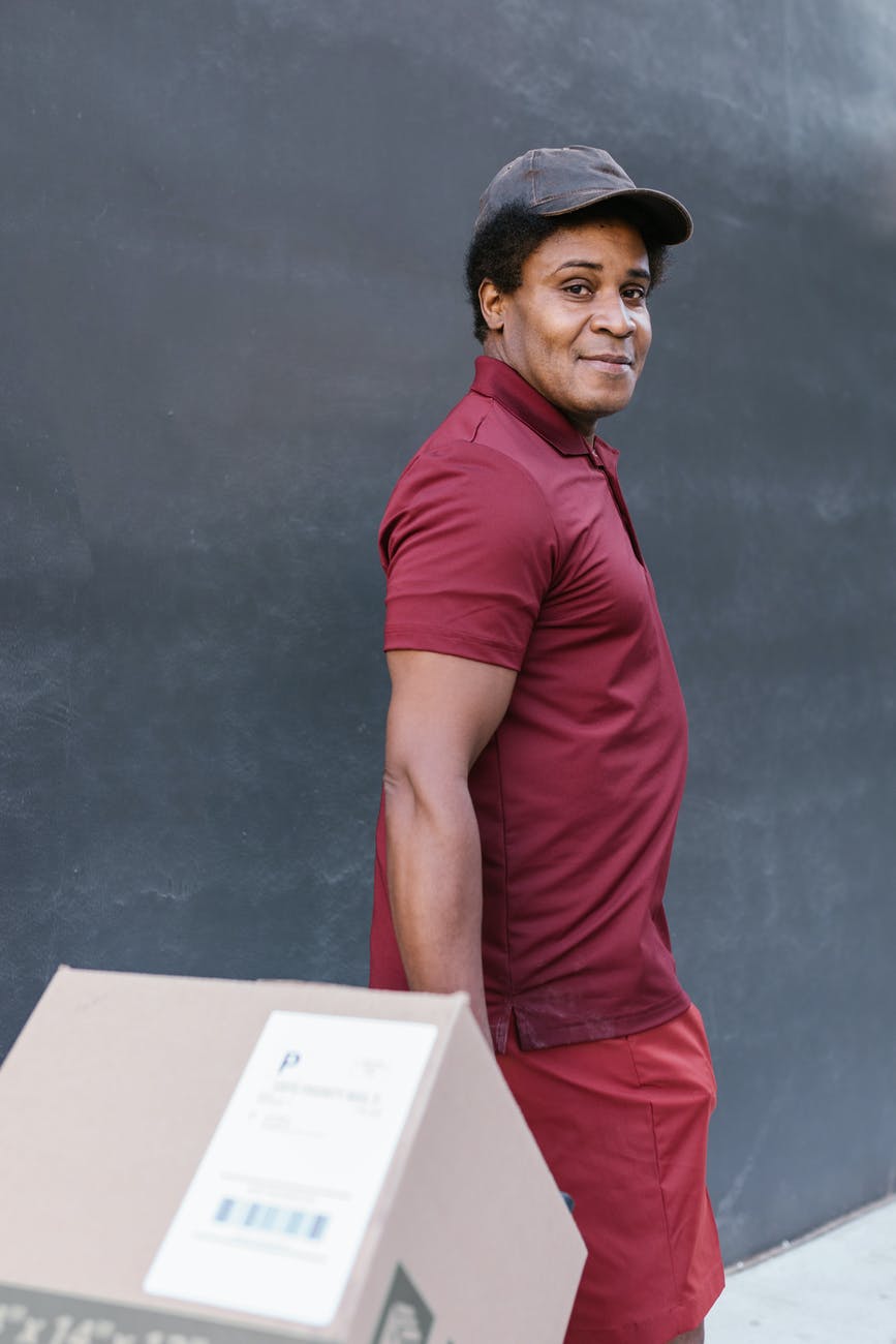 a deliveryman carrying a package