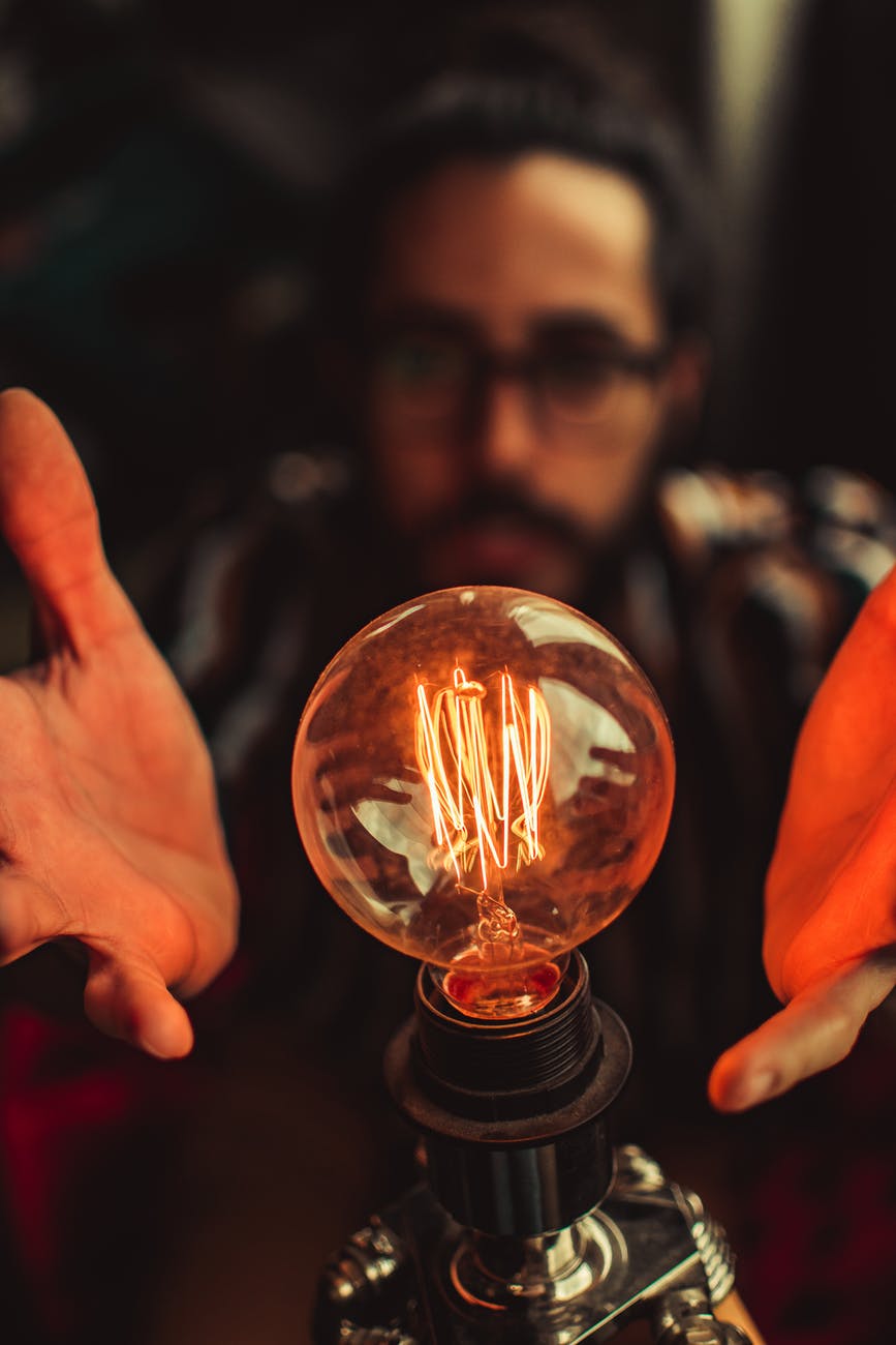 man about to hold plasma ball